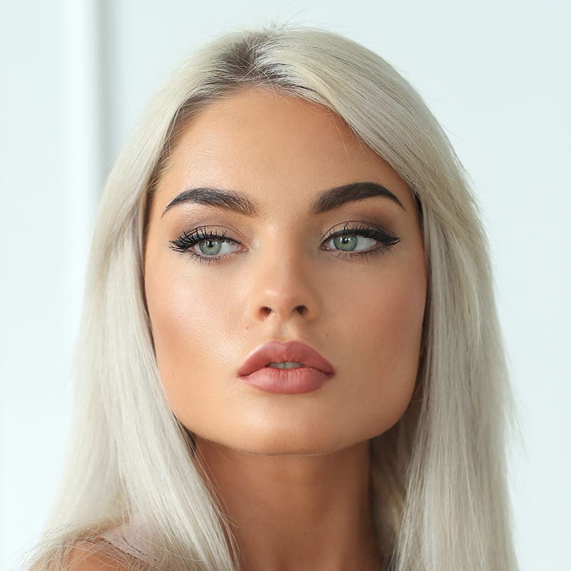 Women's platinum blonde hair styling at North Style Salon