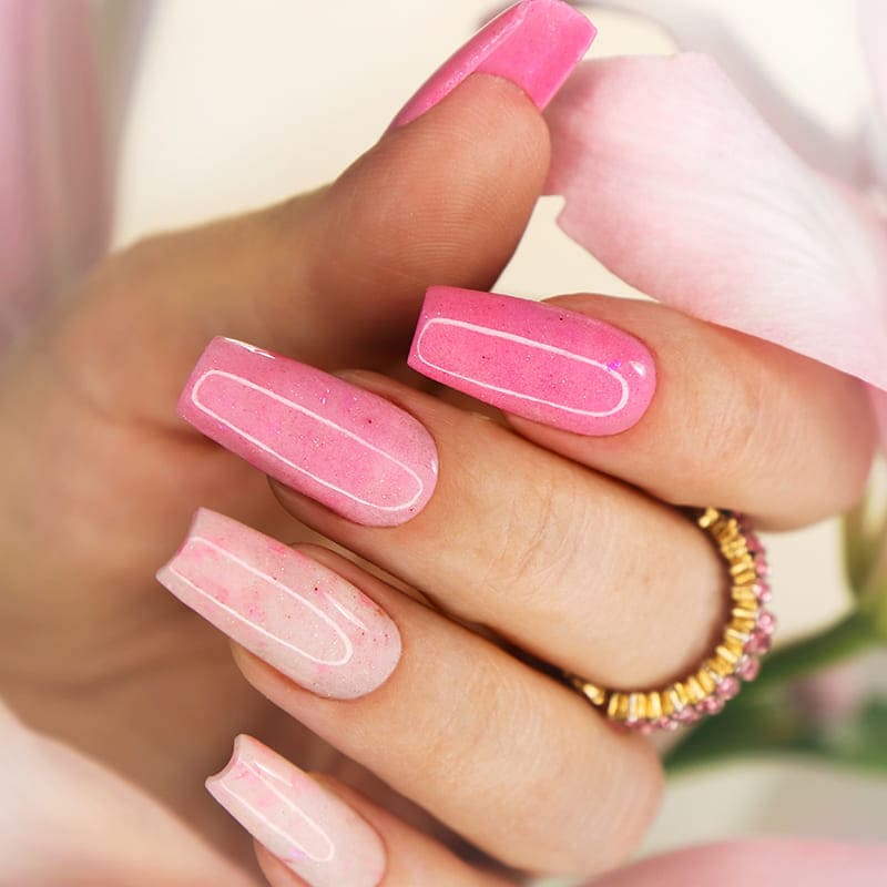 Professional manicure with pink nail polish